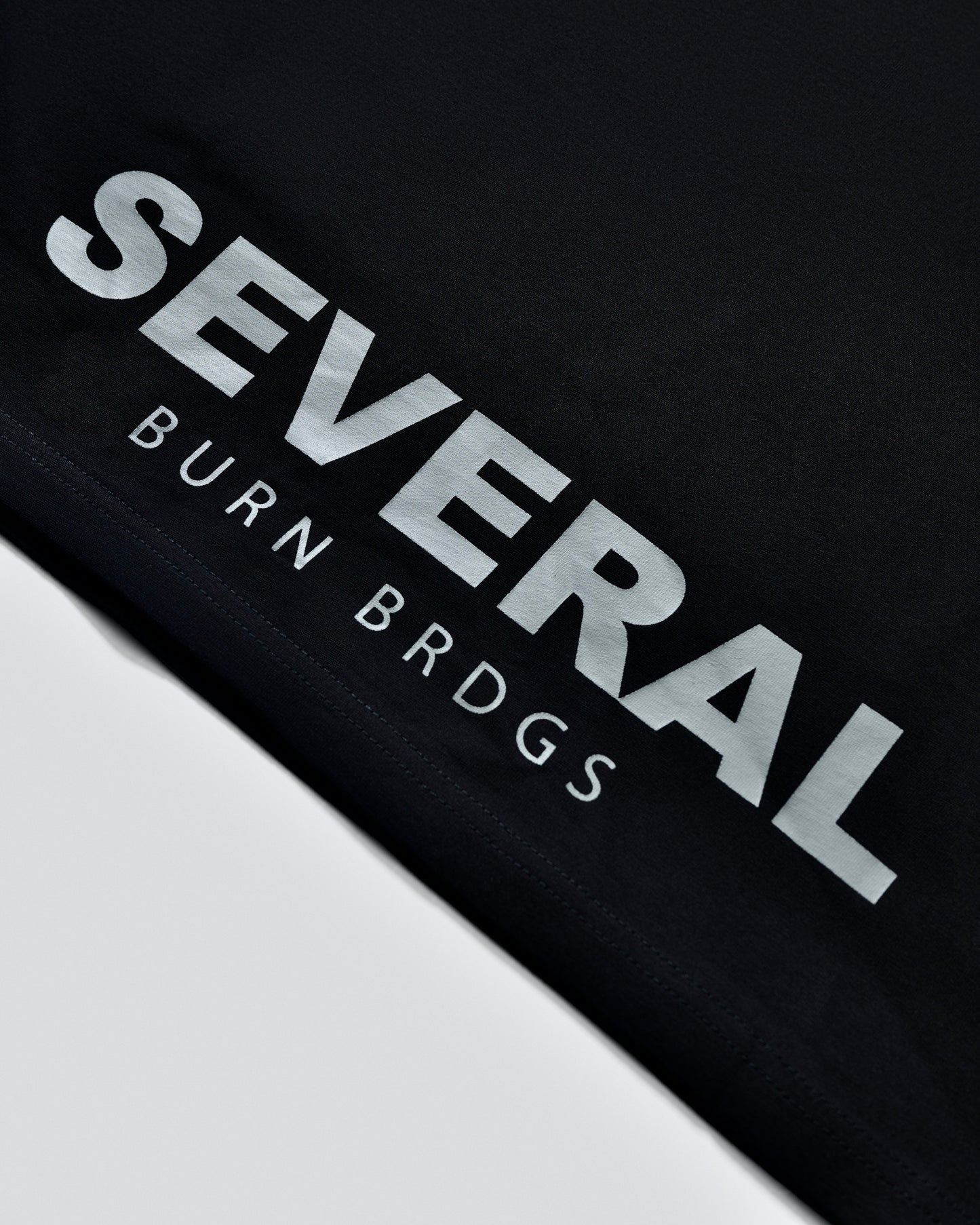 Several Community Basics - Black Tee